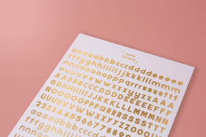 Gold foil rub on characters